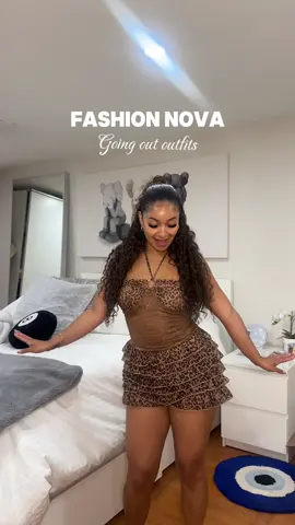 A post by @ on TikTok caption: summer night out fits 😍🐆 @Fashion Nova  •Ivy Leopard Mesh Romper- Brown/Combo (S) •Ruffles And Roses Mini Dress- Brown/Combo (S)  #fashionnovapartner #fashionnovahaul #fashionnovahaul 