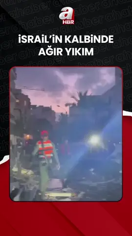A post by @ahaber on TikTok caption: #İran'ın #İsrail'e düzenlediği misilleme saldırılarda #TelAviv kentinde birçok noktada patlamalar yaşandı. Kentte birçok bina hasar gördü, ölü ve yaralıların olduğu bildirildi.