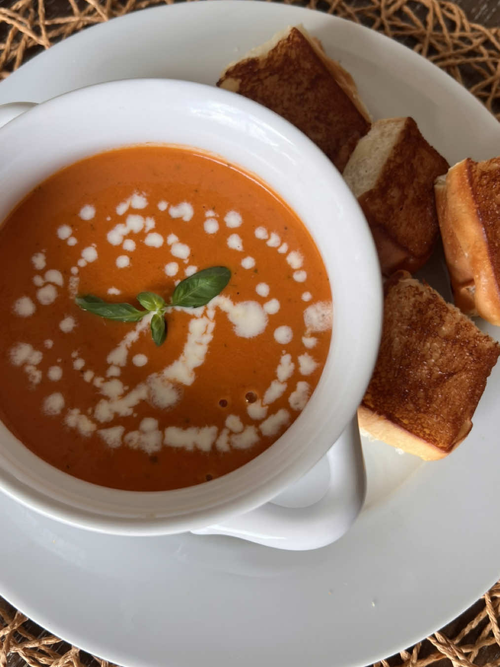 A post by @britscookin on TikTok caption: Roasted Tomato & Basil Soup!😆🌿🍅 What I used: 	•	3 lbs fresh tomatoes (chopped) 	•	1 red bell pepper (chopped) 	•	2 whole bulbs of garlic (top sliced off) 	•	1 red onion (chopped) 	•	1 large shallot (chopped) 	•	A few basil stems for roasting 	•	Handful of fresh basil leaves (added before blending) 	•	Olive oil 	•	Britscookin Garlic & Herb seasoning 	•	2 cups chicken bone broth 	•	Salt, to taste 	•	½ cup heavy cream 	•	Splash of balsamic vinegar How I made it: 	1.	Preheat oven to 425°F. 	2.	Add tomatoes, red bell pepper, garlic bulb, onion, shallot, and a few basil leaves to a sheet pan. 	3.	Drizzle with olive oil and season with salt, pepper and a good sprinkle of Britscookin Garlic & Herb. 	4.	Roast for 30 minutes or until veggies are soft and edges are charred. 	5.	Transfer everything to a pot, squeeze out the garlic, and pour in 2 cups of chicken bone broth. (Or any broth of choice) 	6.	Add a handful of fresh basil leaves and blend until smooth using a hand mixer or blender. 	7.	Stir in ½ cup of heavy cream, season with salt to taste, and finish with a splash of balsamic vinegar. #tomatosoup #soup #summerrecipes #yum