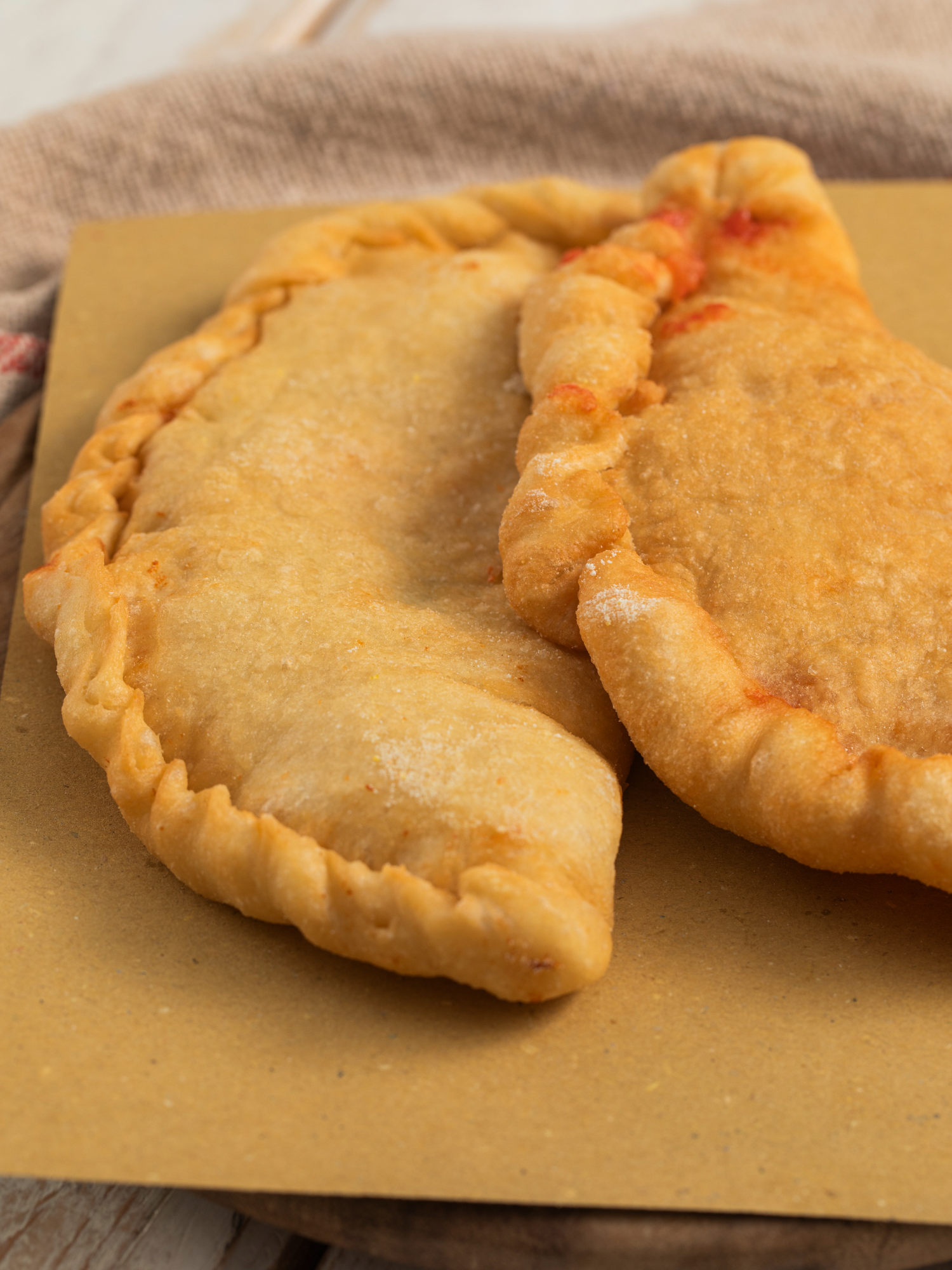 A post by @giallolovesitaly on TikTok caption: ✨ Golden, cheesy, and straight from Italy!💛 These Fried Panzerotti are everything you love: crunchy on the outside, gooey on the inside 🤩 Perfect for sharing… or not!😉 @cooker.girl Ingredients for the dough: 4 cups bread flour (500g) 1¼ cups water (300g) 2 teaspoons active dry yeast or 0.2 oz fresh yeast (6g) 2 teaspoons extra virgin olive oil (10g) 2½ teaspoons salt (15g) For the filling: ⅔ cup tomato sauce (150g) 1½ cups mozzarella, chopped and well drained (180g) 2 teaspoons extra virgin olive oil (10g) Salt, to taste For frying: Peanut, sunflower, or canola oil (enough for deep frying) #giallolovesitaly #panzerotti #foodtok