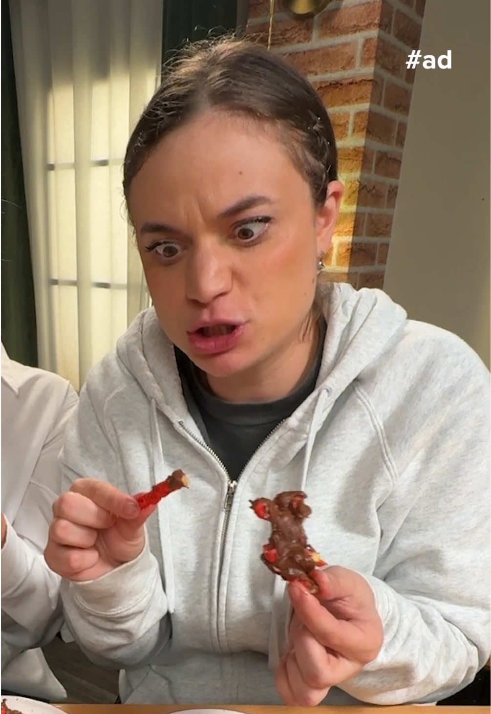 A post by @smosh on TikTok caption: #flvr_partner Cheetos Flamin’ Hot and chocolate go together? Like actually??? @flvr @Chester Cheetah @Flamin’ Hot 