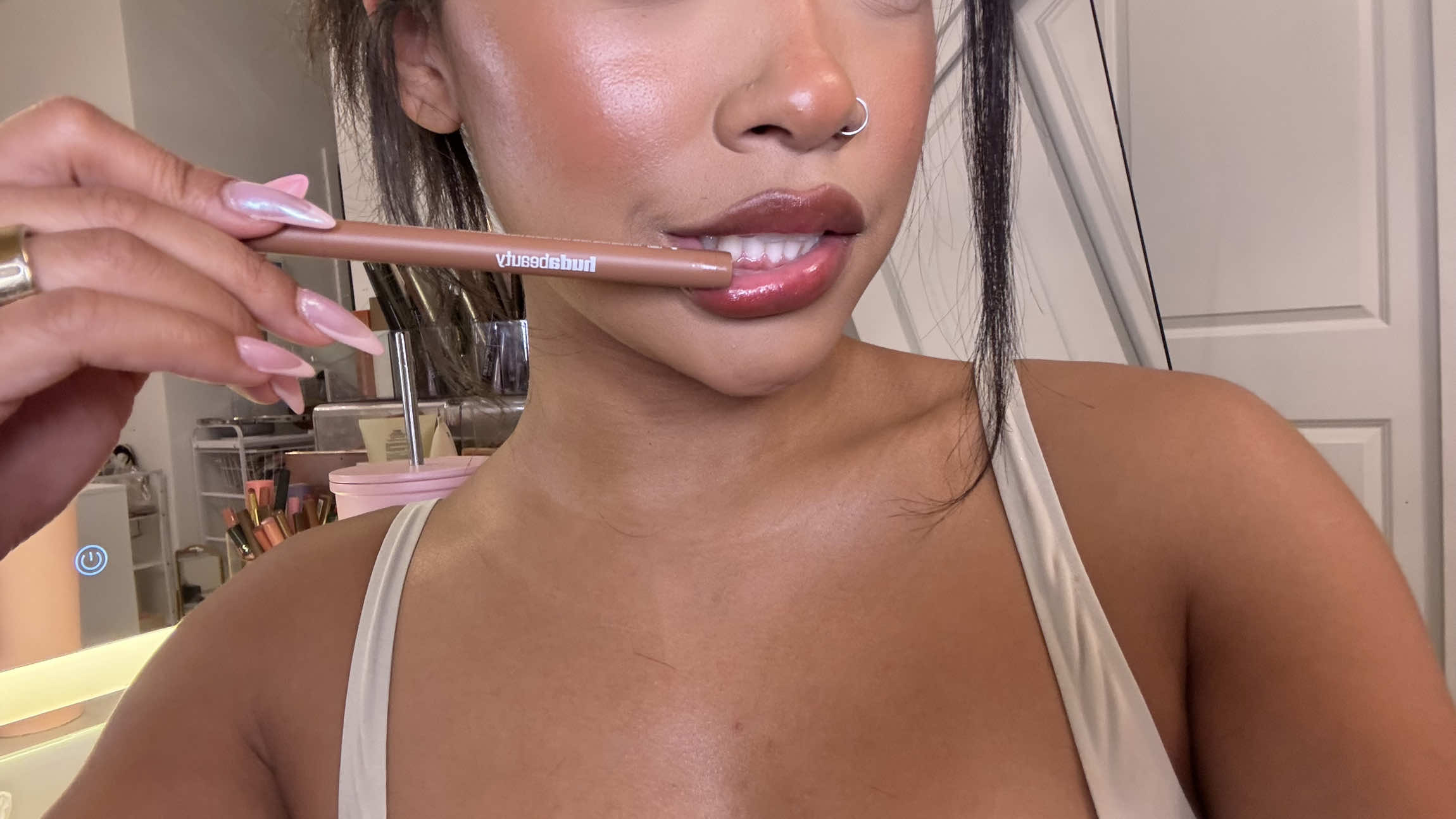 A post by @leilanigreen on TikTok caption: HUDAAAAAAAAA!!!! Genius. And you don’t need to wash it off with water to get the stain. 👏 @Huda Beauty #newmakeup #hudabeauty 