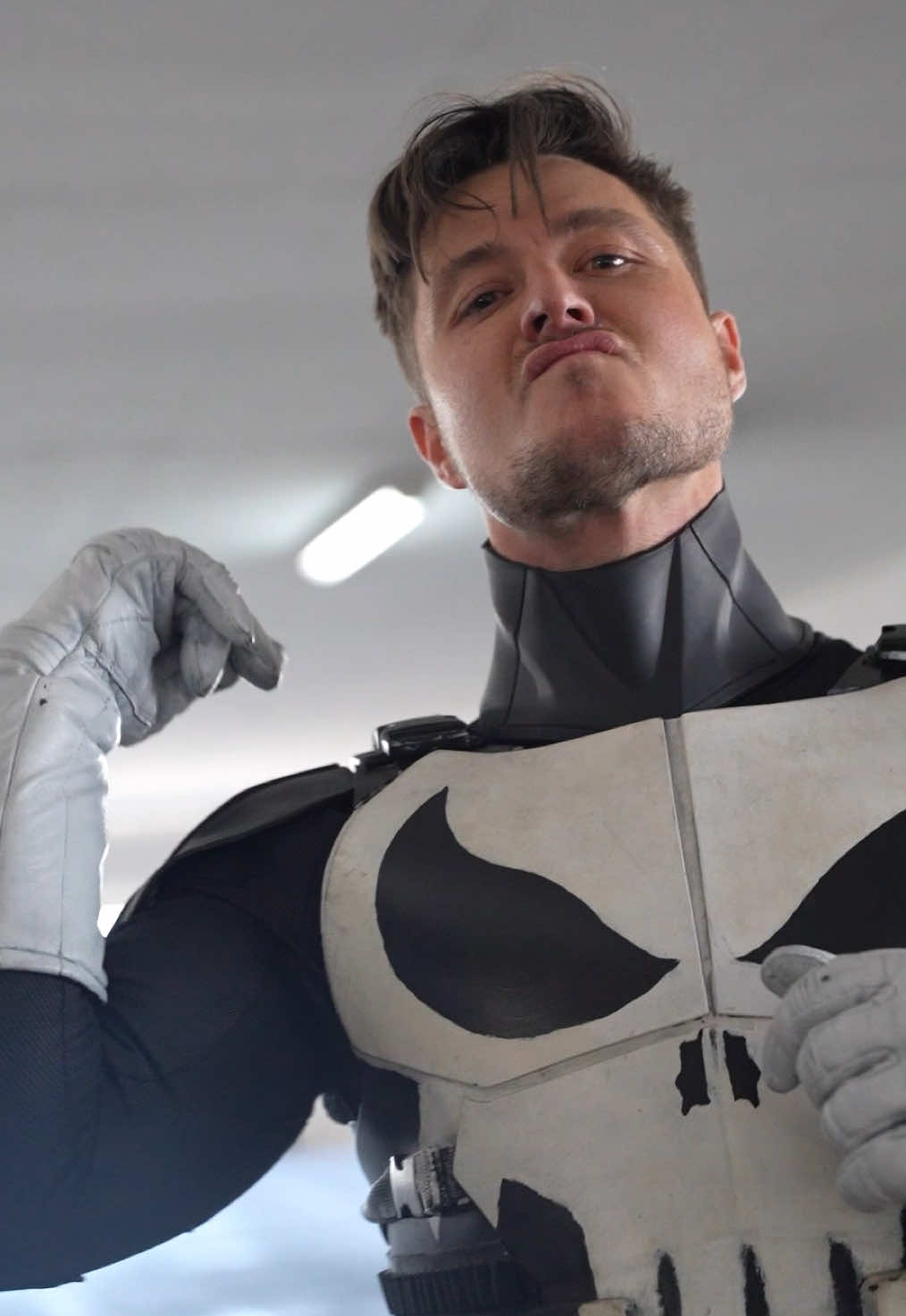 A post by @alex.stemp on TikTok caption: Punisher trades me his fit 🤝 #FitSwap with @Caleb Weeks #cosplay #marvel #cosplay 