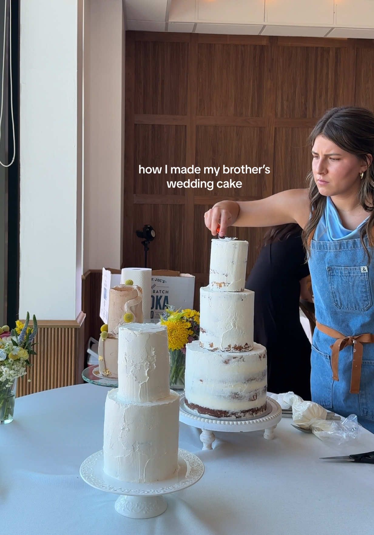 A post by @zoebarriesode on TikTok caption: signing off from my first and last time making tiered wedding cakes 🫡 (congratulations to two of my favorite people on their nupitals) ❤️🫂  #weddingcake #cakes #wedding #cooking 