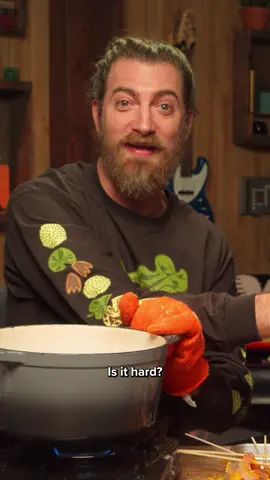 A post by @mythical on TikTok caption: 🗣️ IS IT HARD? #GoodMythicalMorning #GMM #tanghulu #tanghulurecipe #tanghuluathome #tanghulututorial