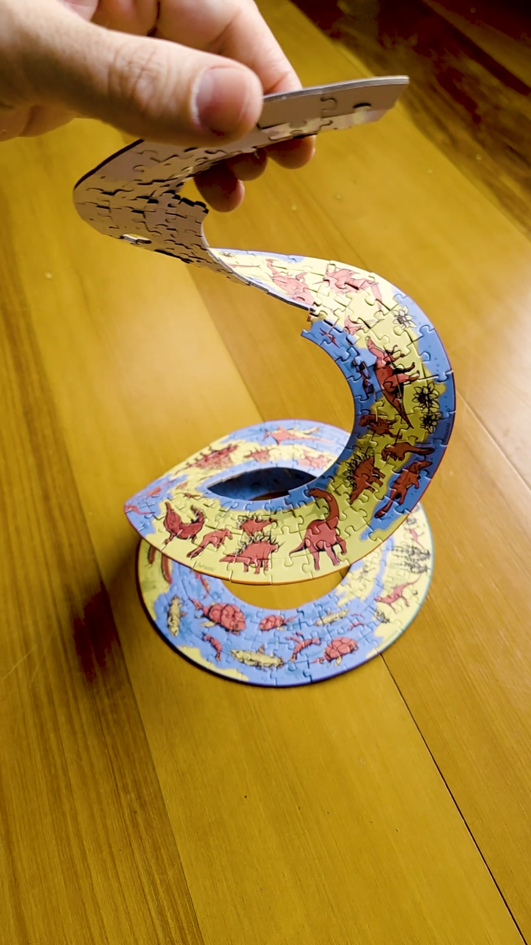 A post by @corndogwilly on TikTok caption: The History Of Life Helix Puzzle 🧬🌿CuriosityBox.com 🐚🐒