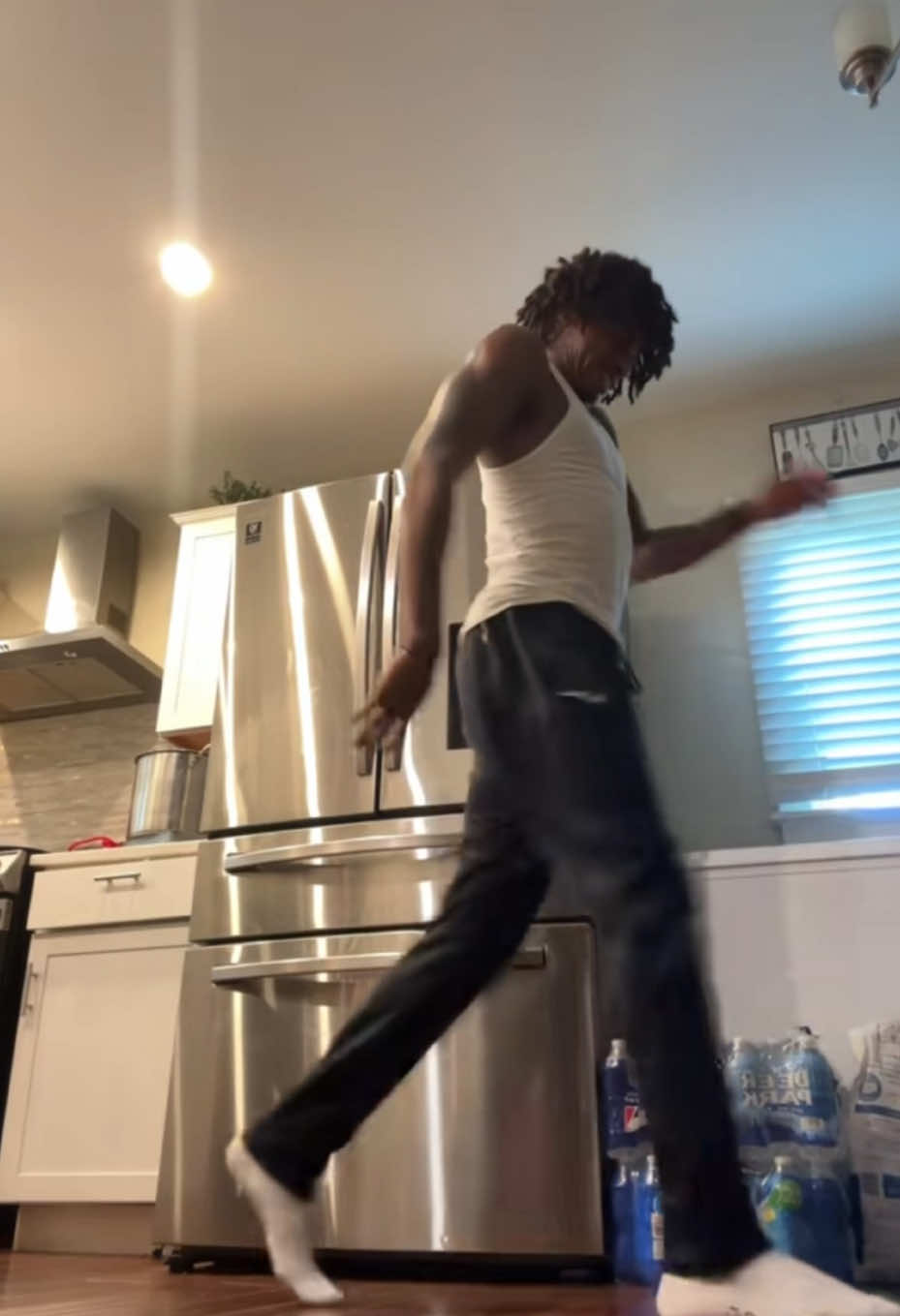 A post by @temptaetiontv on TikTok caption: #Stitch with @Kinston Ali I just want my lasagna bro…(all jokes aside he killed that dance 🔥) #foryou #dance #reaction #kitchen #leftovers 