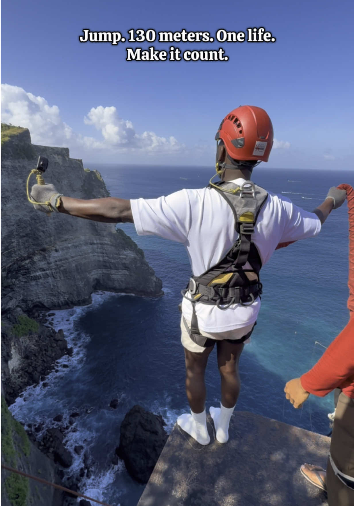 A post by @kaaramoo on TikTok caption: Jump. 130 meters. One life. Make it count. #xparkbali #nusapenida #jump #aventure #bali 