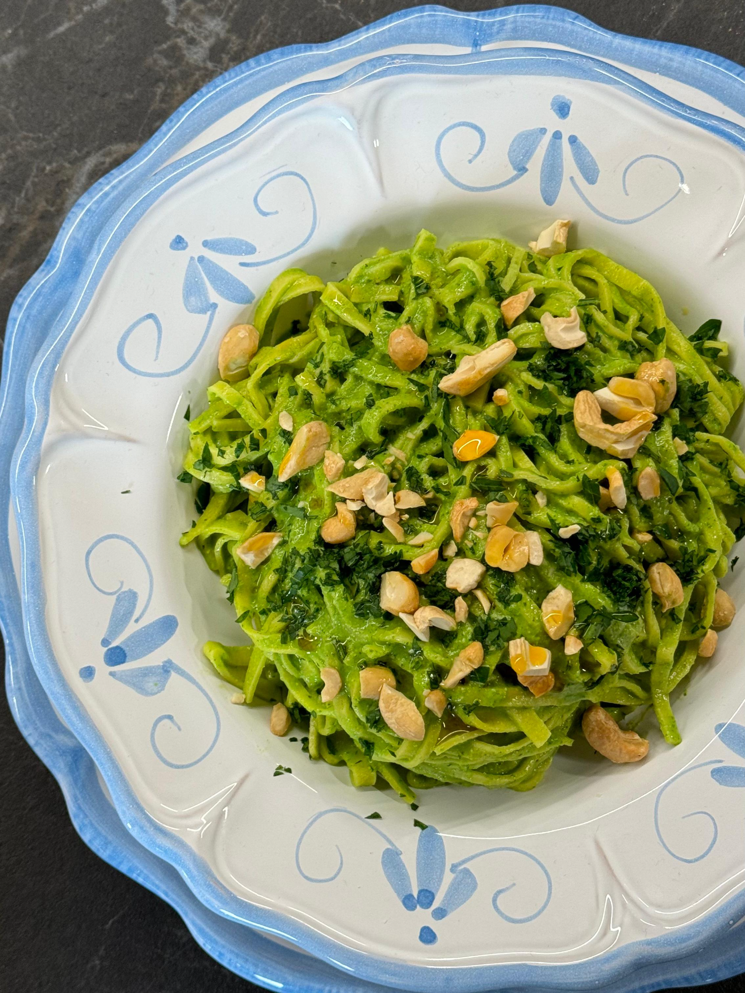 A post by @giallolovesitaly on TikTok caption: Say hello to bold greens and zesty dreams 🌿🍋 Our parsley & arugula pesto tagliolini is vibrant, punchy, and super simple. Just fresh herbs, lemon, and handmade pasta magic 😍 @cookwithfez Ingredients For the pasta dough: 2 cups all-purpose flour (300g) 2 large eggs 3 egg yolks For the pesto: 2 packed cups fresh parsley (leaves and stems) (200g) 1 packed cup arugula (100g) ⅓ cup toasted cashews (45g) 1 garlic clove ¼ cup grated cheese (Parmigiano Reggiano or similar) (30g) 5 tablespoons extra virgin olive oil (75ml) 1 lemon (zest + juice) Pinch of salt 1 ice cube Optional for finishing: Chili oil, to taste #giallolovesitaly #pasta #arugula #foodtok
