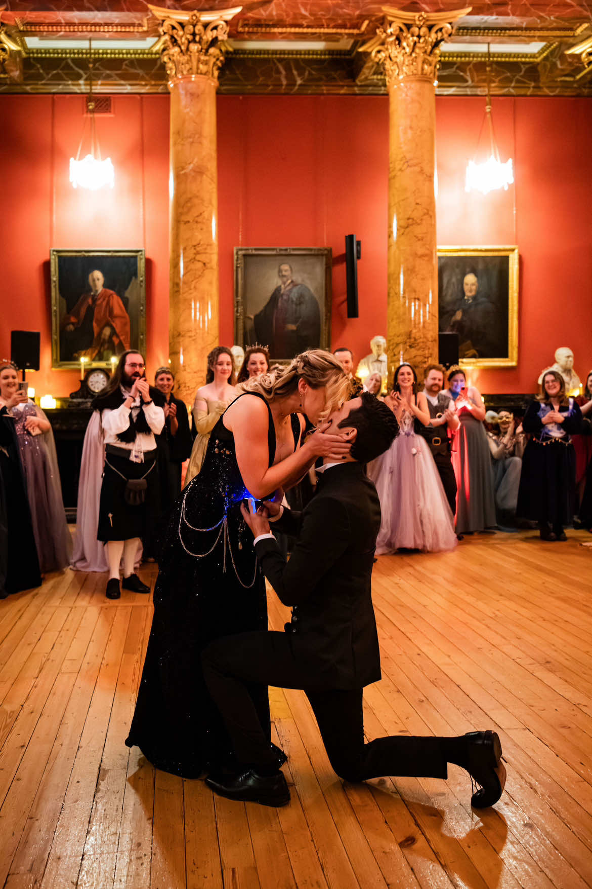 A post by @mysticfateuk on TikTok caption: What could be more romantic than proclaiming your love at a ball?  Jonathan had reached out to us a few months before our Crown and Dagger Ball in Edinburgh. He was so sweet and kind when discussing his girlfriend Jennifer, wanting to make sure that she felt special and loved when he would pop the question. After a night of historical dancing in this beautiful ballroom and side quests, Jonathan surprised her with a speech fit for any romance book. They danced the rest of the night away in each others arms.  We were so grateful to be part of this special moment for the couple and are truly grateful that our ball was chosen as the setting for this moment. Please give the couple a big congratulations! #fantasyball #BookTok #fantasyevent #larp #proposal #engagement #renfaire #medievalstyleoutfit #currentread #romancebook #prideandprejudice 