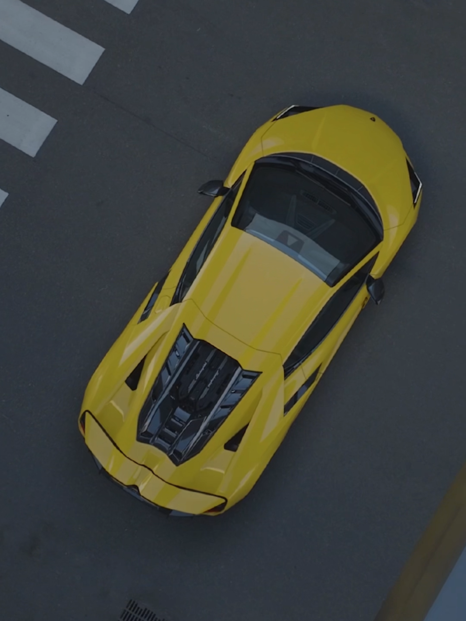 A post by @lamborghini on TikTok caption: Defining a new paradigm in terms of performance, sportiness and driving pleasure: Lamborghini Revuelto in Giallo Countach is a flash of bright, powerful personality. Even more when is dressed in yellow. #Lamborghini #Revuelto #FromNowOn