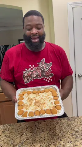 A post by @yo_thats_erica on TikTok caption: He so serious about the Banana Pudding 🍌😩😂😂❤️ #thatmanandthemkids #bakingwithbae #Bananapudding 