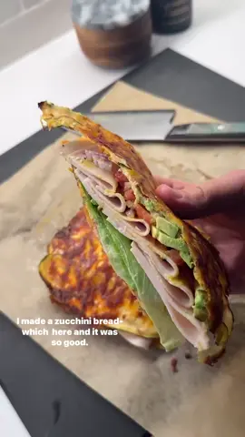 A post by @ketorecipes on TikTok caption: 💥ZUCCHINI BREADWICH This is a lowcarb bread option thats ACTUALLY good. If you want a low-carb sandwich that hits the spot—this one’s for you. The cheese is actually baked into the zucchini, making a great flatbread like vessel that you can use to make your favorite lowcarb, keto-friendly sandwich. Top it up with whatever you want.  Here’s how to make it: 1.Preheat your oven to 400F. Grab 1 large zucchini and thinly slice it using a mandoline or vegetable peeler. 2.Lay the slices on a paper towel and pat them dry.  3.Grab an oven-safe tray, line it with parchment paper, and sprinkle a thin layer of cheddar cheese directly on the paper. Lay out your zucchini slices slightly overlapping to form a rectangle. Sprinkle on some garlic powder (and smoked paprika if you’re feeling fancy), then add another thin layer of cheese on top. 4.Pop it in the oven for 14–15 minutes until the edges are golden and the cheese is crisp. Let it cool slightly, then cut it in half to make your “bread” slices. 5.I used avocado mayo and mustard as my spread, then layered on organic chicken (turkey or ham would work too), lettuce leaves, a few tomato slices, red onion, 1/3 of an avocado, and everything bagel seasoning.  6.Add the top piece, slice diagonally like a sandwich, and enjoy. If you try this, be sure to let me know on SHREDHAPPENS. ENJOY! . . . . . . #lowcarb #lowcarbrecipes #keto #ketorecipes #healthyrecipe #goodmoodfood #healthyfoodshare