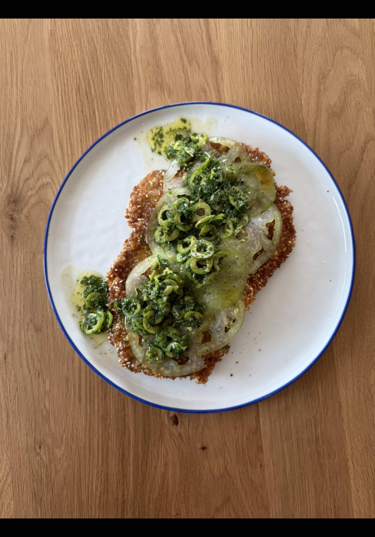 A post by @chuckischarles on TikTok caption: Fried pork cutlet with green tomatoes