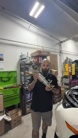 A post by @olie_olie_paintz on TikTok caption: Downpipe day with @Private Label Mfg v2 catted downpipe. Use code OLIE to save some $$ on your next mod site wide! #PLM #fk8 