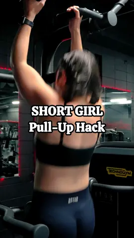 A post by @fit.with.alena on TikTok caption: Pull-Up HACK for shorties! 💪 Comment “COACHING” to work with us 👇 #pullups #shortgirl #shortgirlproblems #assisstedpullups #gymhack #gymtips #gymtipsforwomen #shortgirlissues 