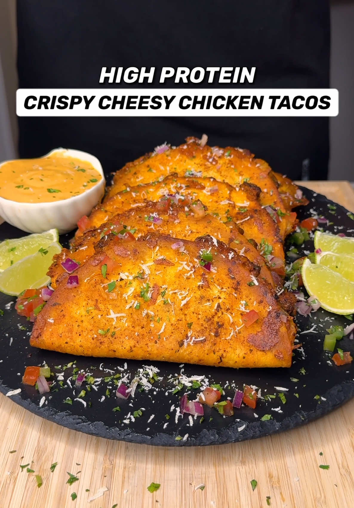 A post by @jalalsamfit on TikTok caption: High Protein Crispy Cheesy Chicken Tacos🌮🍗 Packed with 25g of Protein, super crunchy and perfect for weight loss!🔥 Check out my Digital Cookbooks with 230+ Delicious Recipes like this with full detailed breakdowns👨‍🍳📕 Macros Per Serving (Makes 6 Tacos) 276 Calories | 25g Protein | 16g Carbs | 12g Fat Ingredients Chicken & Seasonings - 600g Raw Boneless Skinless Chicken Thighs, cut into small cubes - 1.5 Tsp Salt - 1.5 Tsp Garlic Powder - 1.5 Tsp Onion Powder - 2 Tsp Smoked Paprika - 1.5 Tsp Parsley - 1.5 Tsp Oregano - 1 Tsp Cumin - 2 Tsp Olive Oil - Cooking Spray or Light Butter (for cooking) Taco Assembly - 6 Mini Street Soft Tacos (Brand: Luchito) - 90g Shredded Mozzarella / 15g per taco - Fresh Salsa (red onion, tomato, coriander, lime juice, black pepper) Creamy Taco Sauce - 150g Low Fat Yogurt - 50g Light Mayo - 50g Chipotle Paste - 1/2 Tsp each: Garlic Powder, Onion Powder, Smoked Paprika, Cumin - Dash of Milk for desired consistency Garnish - Chopped Coriander - Grated Parmesan - Lime Juice (A MUST, trust me) Cooking Notes - Cook chicken on medium high heat in light butter or cooking spray for 6-8 mins till golden brown and seared - Rub each taco on one side with the chicken juices - Assemble with mozzarella, cooked chicken, salsa (in this order) - Repeat for 6 tacos, oven bake or air fry 8-10 mins 200C/400F flipping halfway to crisp both sides - Serve hot with the sauce, garnish, add a squeeze of lime and ENJOY! . . . . #tacos #chickentacos #taco #highprotein #healthyrecipes #lowcalorie #crispychicken #healthymeals #foodie #weightloss #healthymealideas #chickenrecipes #mexicanfood #easyrecipes #fitness #jalalsamfit 