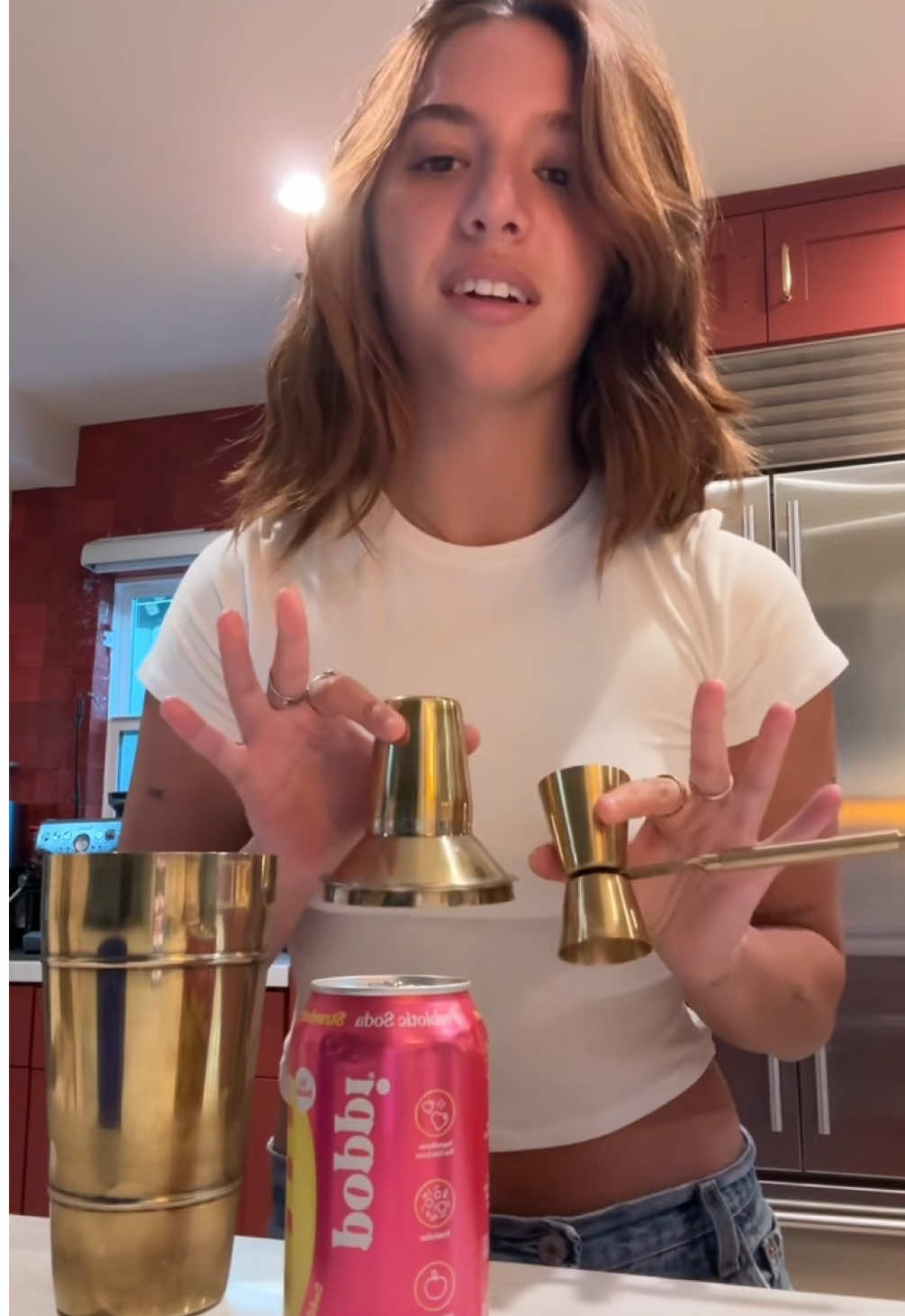 A post by @mackenzieziegler on TikTok caption: make my first legal drink with me using @Drink Poppi #poppipartner #sodasback 🩵 