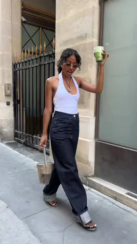 A post by @sarahndiaye on TikTok caption: Can't get over these jeans @sourceunknown.official @KOOKAÏ @COS @Shevoke Eyewear #ootdfashion #summerstyle #SummerFashion 