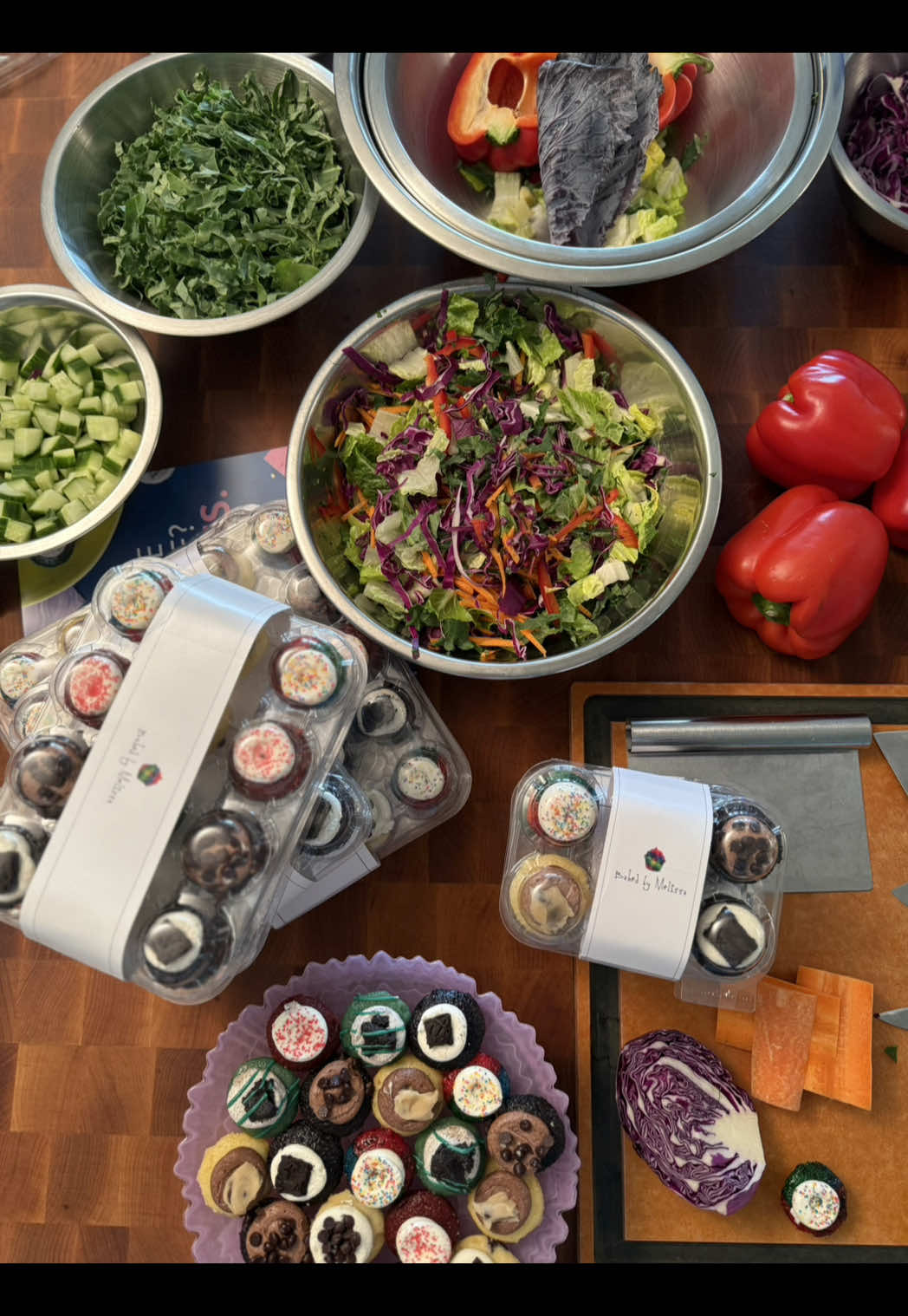 A post by @bakedbymelissa on TikTok caption: HARD LAUNCH: My Rainbow Kale Salad with my drool worthy Miso Vinaigrette dressing + Baked by Melissa bite-size cupcakes available at ALL @Wonder locations starting RIGHT NOW. Use code MELISSA at checkout for 50% off your first purchase. You’re welcome and I love you 💚🌈