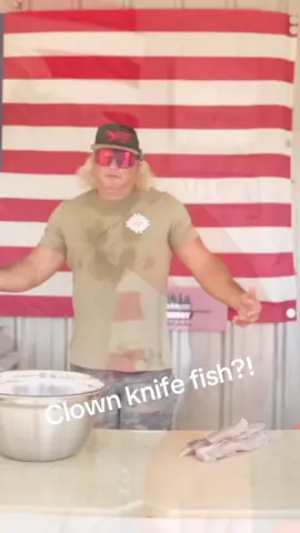 A post by @stalekracker on TikTok caption: Come along as we turn the invasive into irresistible - the clown knife fish goes from water to table in savage style. #InvasiveToDelicious #ClownKnifeCatch #SwampToSupper #WaterToTable #FeastOnTheBeast #Flofidalnvasives #WildCaughtEats 