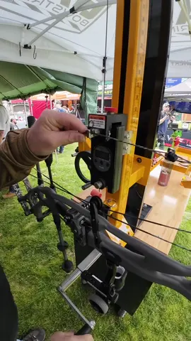 A post by @bowhunterplanet on TikTok caption: Chatting with Eric Griggs on the new Archery Tooling Concepts bow press and draw board #archery #bowhunting 