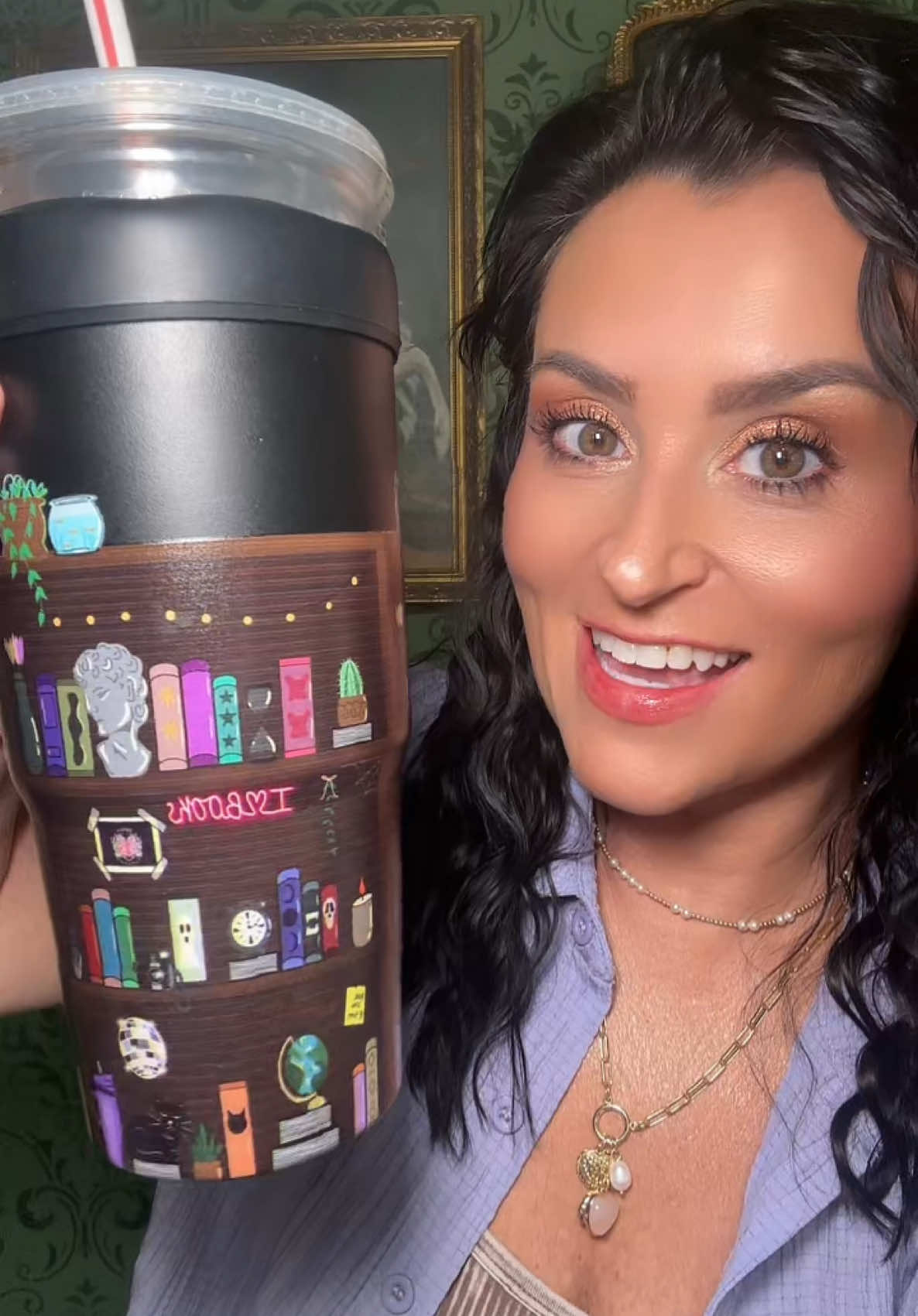 A post by @tiffsghosttalk on TikTok caption: @Frost Buddy for all the book and spooky fans #frostbuddy #coffee #tumbler #book #BookTok #bookish 