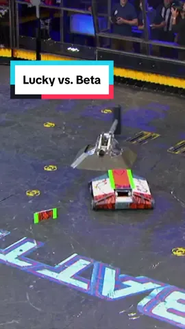 A post by @battlebots on TikTok caption: It’s a #BattleBots beat down as Beta tries to crush Lucky’s hopes—one swing at a time