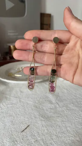 A post by @likayjewel_diylilylin on TikTok caption: Cocktail inspired tourmaline wire wrapped earrings 🍸✨🌈#earrings #handmadejewelry #foru #earringslovers #earringmaking #handmadeearrings #uniqueearrings #rainbow #tourmaline 