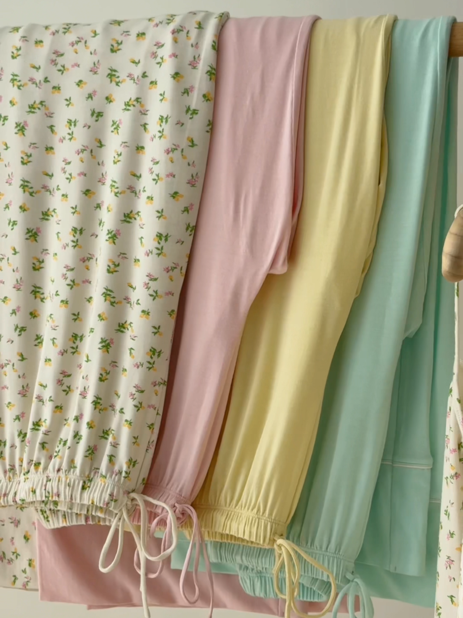 A post by @ohpolly on TikTok caption: Lose track of time with the cutest lounge staples, wrapped in a pretty pastel palette. Late Checkout launching 5pm BST 🎀 #ohpolly #summerlooks #softliving #eurosummer #butteryellow #spring #slowmorning #loungewear #outfitinspo