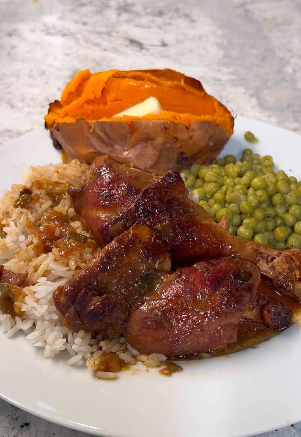 A post by @britscookin on TikTok caption: Sticky chicken, smothered chicken—this version’s a little different because we’re using sugar as a browning agent! You can use this method for so many proteins, and it makes the BEST gravy. One of our family favorites! What You Need: • 3 lbs chicken (I used boneless thighs and drumsticks) • Brit’s Cookin Cajun Seasoning • Onion powder • Garlic powder • 2 tbsp white sugar • Equal parts vegetable oil (eyeball it to match the sugar) • 1 yellow onion, diced • 1 bell pepper, diced • 1–2 tbsp minced garlic • Water or low-sodium chicken stock (enough to almost cover the chicken) • 1 tbsp Better Than Bouillon roasted chicken base • Dried parsley How I Make It: 	1.	Season the chicken with Cajun seasoning, onion powder, and garlic powder. Coat it really well and set it aside. 	2.	In a heavy-bottomed pot, add white sugar over medium heat. Drizzle in equal parts vegetable oil and stir constantly until it turns the color of Coke. If it starts to smell burnt—you overcooked it. Don’t use it, just start over. (This is for browning, not sweetness!) 	3.	Carefully drop the seasoned chicken into the pot and brown it on both sides. Once browned, remove it and set aside. 	4.	Add the onion and bell pepper to the pot, season with 1 tsp Cajun seasoning, and sauté until soft. Add a splash of water if needed to deglaze the pot. 	5.	Once the veggies are soft, mash them down, stir in the garlic, and cook a few more minutes. 	6.	Return the chicken to the pot, then pour in enough water (or stock) to almost cover it. 	7.	Stir in the roasted chicken base, ½ tbsp Cajun seasoning, and 1 tbsp dried parsley. 	8.	Bring to a boil, then lower the heat, cover, and let it simmer low and slow for a few hours. Add more liquid as needed & adjust seasoning to your taste. The longer it cooks, the better that gravy taste! C’est ce bon! #smotheredchicken #easyrecipe #comfortfood 