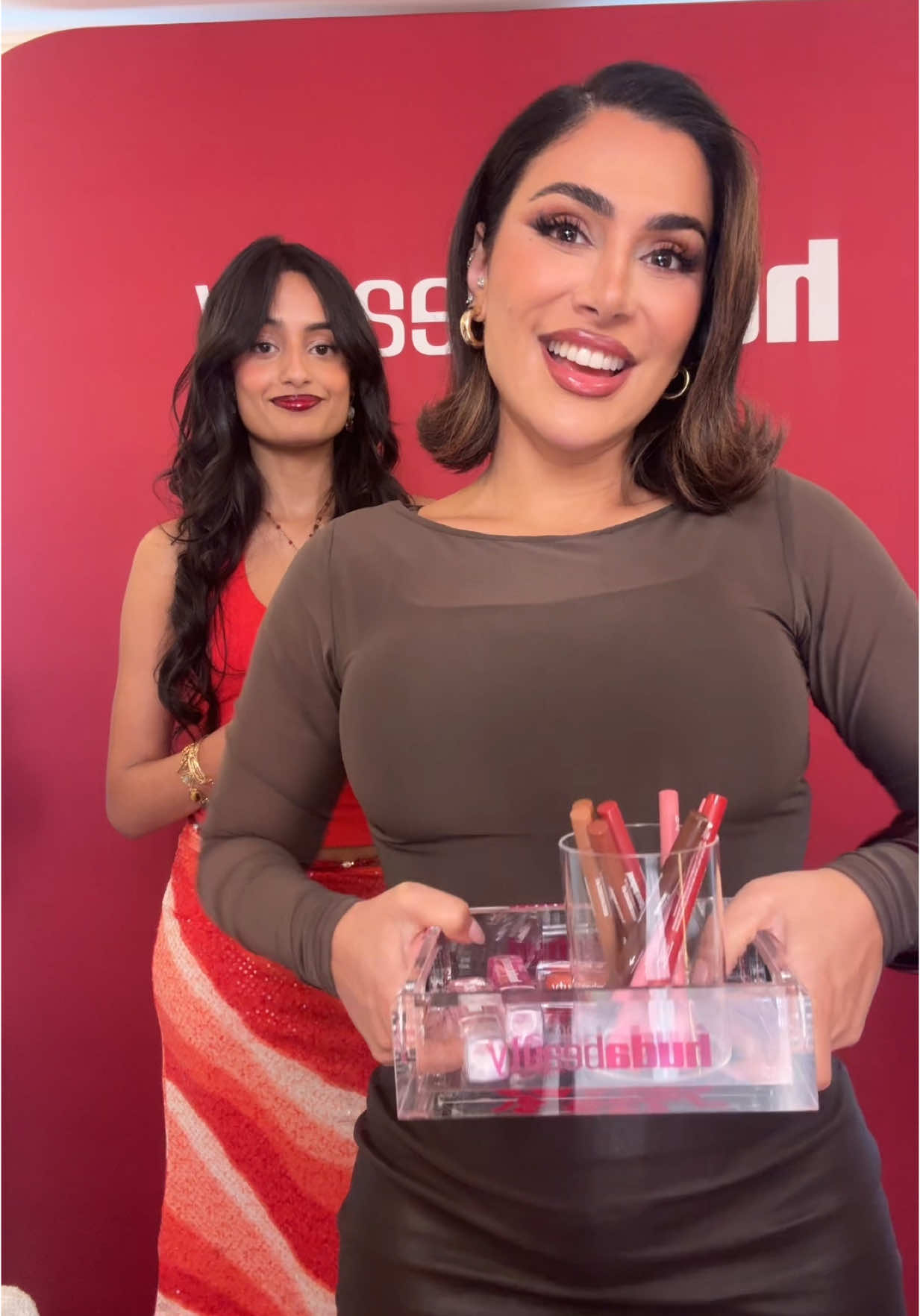 A post by @sabrinabahsoon on TikTok caption: You guys BETTER check out @Huda Beauty NEW Lip Contour Stain and FAUX FILLER Lip Oil!!! @Huda my girl ❤️👄