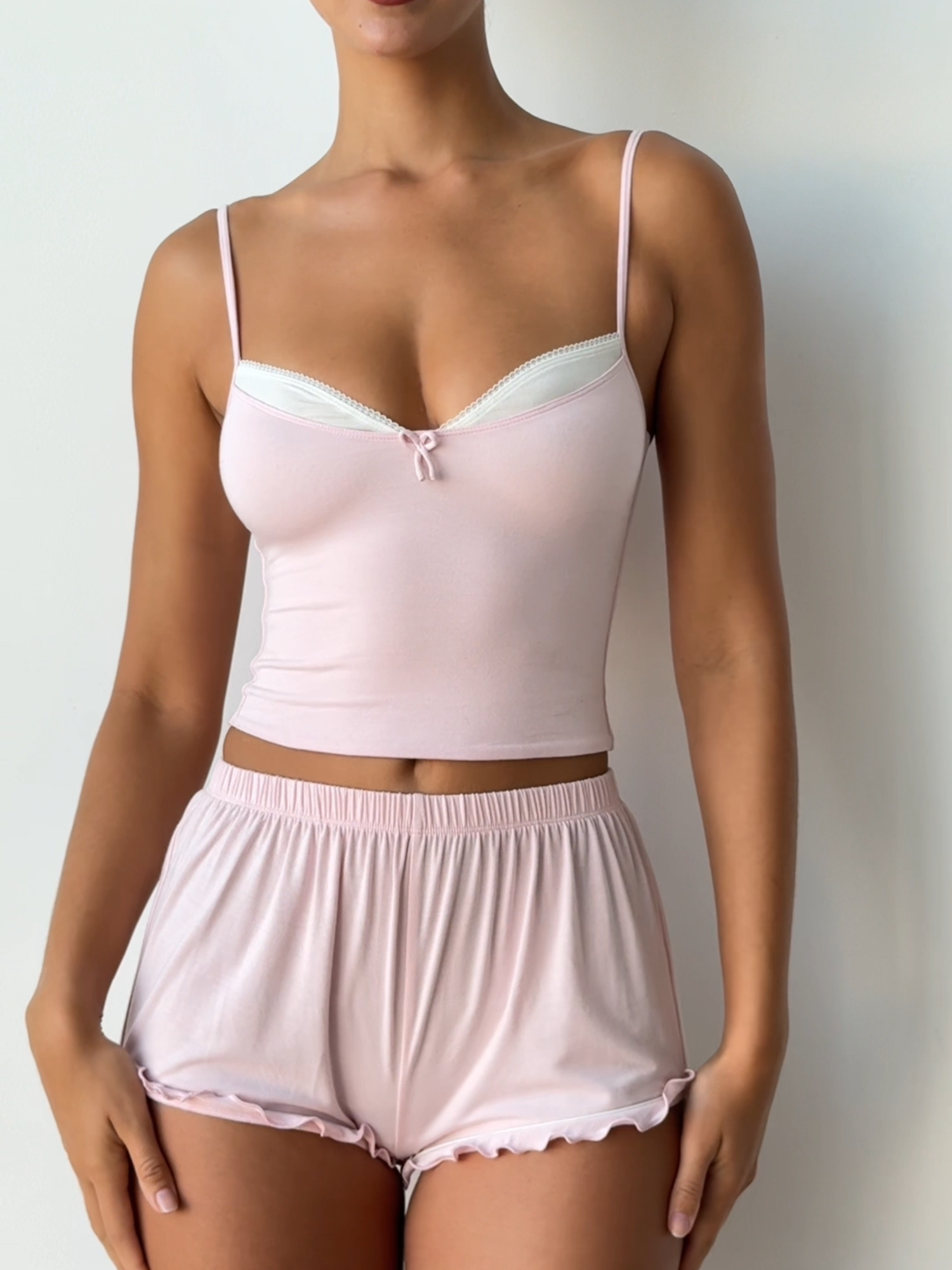 A post by @ohpolly on TikTok caption: Soft, sweet and pretty in pink... Late Checkout now live 🎀 #ohpolly #eurosummer #softliving #spring #babypink #slowmorning #loungewear #outfitinspo