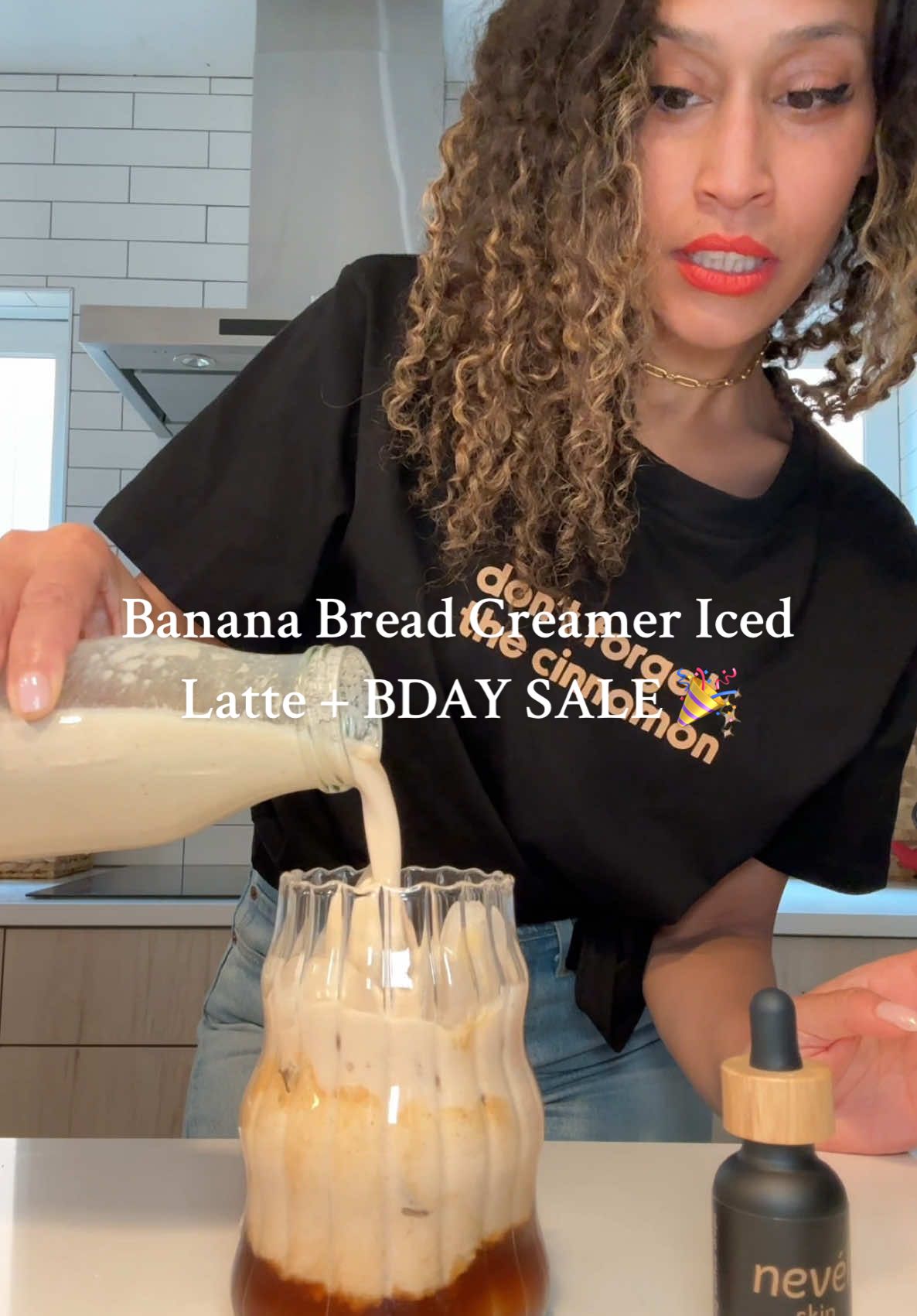 A post by @thejenjones on TikTok caption: Banana Bread creamer for the most amazing iced latte!  1 overripe banana 2 cups coconut water 1/2 cup raw soaked walnuts  1 tsp vanilla 3 pinches of salt Ceylon cinnamon and nutmeg Use code BDAY20 to save 20% off my 5 ⭐️ reviewed @nevéll_skin/ Coffee Infused coffee oil! All DFTC shirts are on sale as well. Go to nevellskin.com  #bananamilk #bananabreadicedlatte #plantbasedrecipes #lattesathome #healthyrecipes 