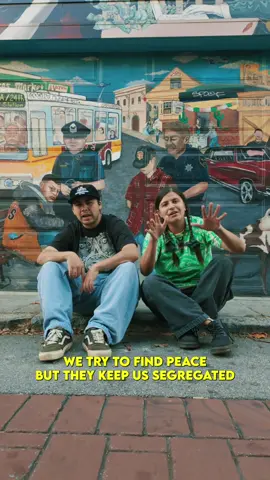 A post by @theneighborhoodkidsmusic on TikTok caption: This is dedicated to the most disenfranchised and silenced, this is for all of the children across the world that have been failed by adults. This song was written for all of the kids and people that have fell victim to abuse and traff! ck!ng. This was also the first song we created with our band. Power to the people and Justice for the Children Song: AND THE KIDS SAY Artist: The Neighborhood  Kids 📸: @fern_doe Mission Makeover Mural in the background by @cialuart  #undergroundhiphop #indigenoustiktok #nativetiktok #raptok #hiphopmusic #indigenousrapper #nativerapper #conscioushiphop 