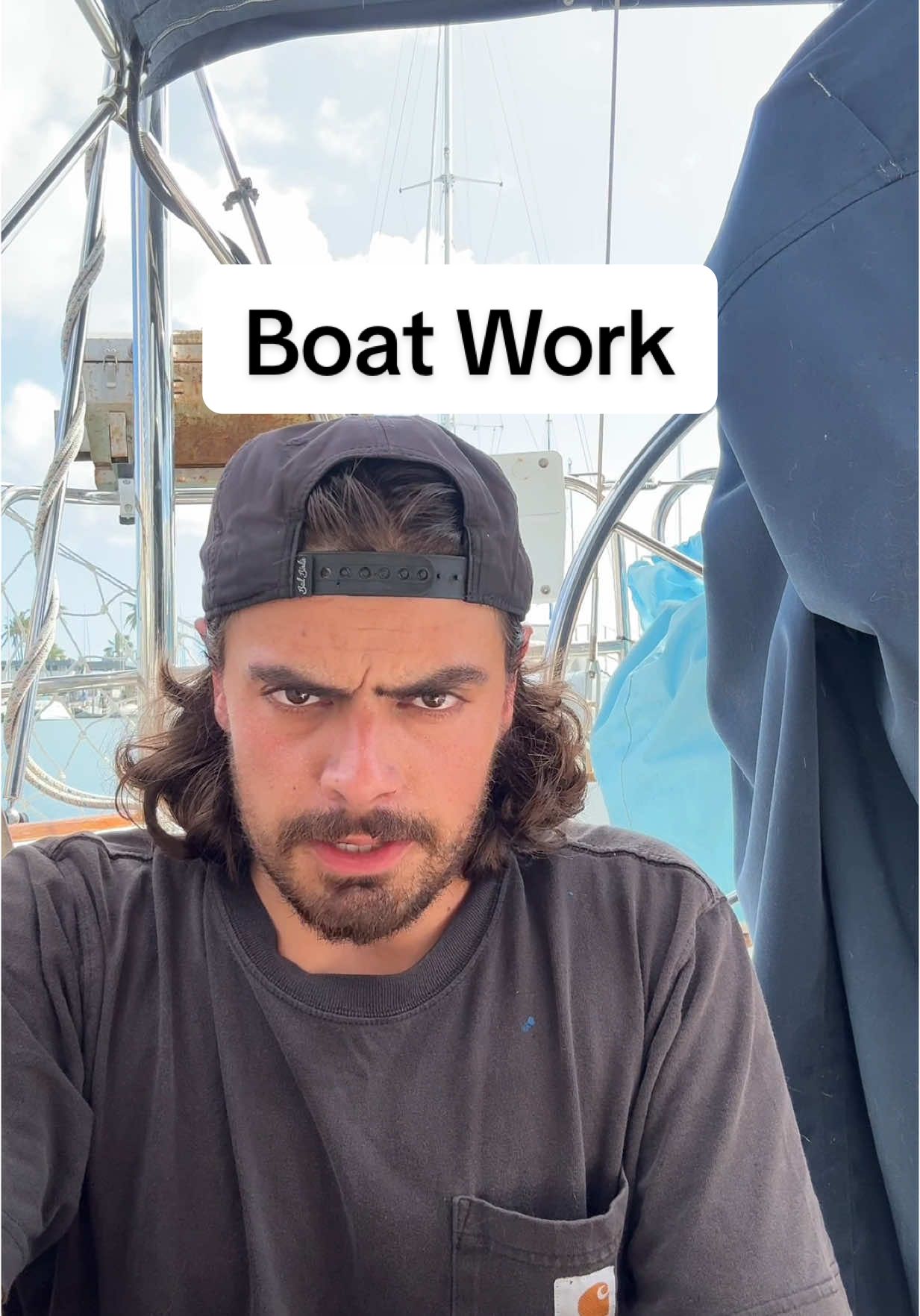A post by @sailing_with_phoenix on TikTok caption: Can’t have a boat without the work.  This life is 80% work, 10% raw fear, and 10% paradise.  #sailinglife #sailing #fyp #dream 