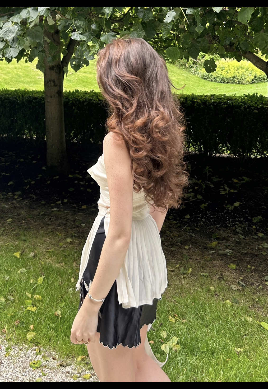 A post by @kelsey_simone on TikTok caption: Walking through Edith Wharton’s gardens 🦢