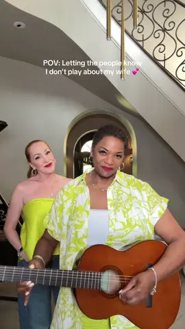 A post by @tracieandcheryl on TikTok caption: Protect her at all costs 🥰🤭❤️ #tracieandcheryl #theaunties  #marriagehumor #guitar 