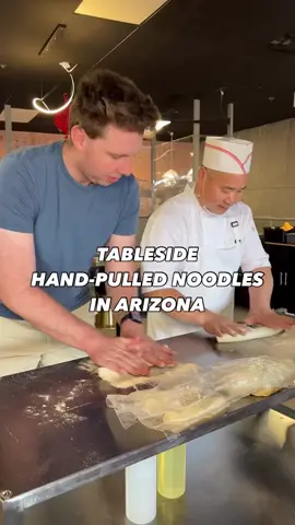 A post by @hungryhotline on TikTok caption: NEW IN ARIZONA! @bingbistro_gilbert is hand-pulling noodles right at your table! This spot is so fun and the menu is packed with noodle dishes, dumplings, bao and so much more! They are super fun cocktails and the staff is amazing! Let us know if you check them out! 📍Bing Bistro 1817 E Baseline Rd Ste 103 Gilbert, AZ  85233 📍Check out their Scottsdale location with an open kitchen concept too! 15577 N Hayden Rd Scottsdale, AZ  85260 #handpullednoodles #bao #baobun #dumpling #soupdumpling #arizona #gilbert #azfood