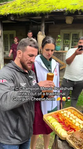 A post by @ninadrama on TikTok caption: UFC Champion Merab Dvalish drinks out of a traditional Georgian cheese horn LOL #UFC #ufc316 #merabdvalishvili #ninadrama #kickboxing #boxing #muaythai #muaythaifighter #muaythaifighter #taekwondo #jiujitsu #brazilianjiujitsu #jiujitsugrappling #jiujitsulifestyle #wrestling #wrestlingtiktok #wrestlingtok #fit #Fitness #grappling #karate #boxing #judo #seanomalley #georgia #georgian #tbilisi 