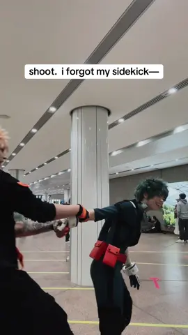 A post by @teacakecos on TikTok caption: my canon sidekick tho, kacchan just doesn’t wanna admit it @Lena_Kuroi / レナくろい 🧡💚 #bakudeku #deku #dekucosplay #bakugoukatsuki #bakugoucosplay #mhacosplay #bnhacosplay #germancosplay