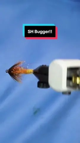 A post by @tiesflies on TikTok caption: TheFlySmith 2-Tone chenille makes quick work of this soft hackle bugger variation! Hook: Ahrex NS118 size 10 Thread: TheFlySmith 32D gsp  Body: TheFlySmith 2-tone chenille Tail: Fulling mill marabou  Hackle: Sideling hill hen  Dubbing: SLF prism  Resin: uv craft  Tools: TheFlySmith  #TheFlySmith  #flytying #magpiematerials #magpieturkeybiots #magpiefinebeaverdubbing #whitingfarms #naturesspiritflytying #lidrig #fly #flytyingjunkie #flytyingtutorial #flytyingaddict #flytok #satisfying #flytyingnation #fyp #harelinedubbin  #fishing #flyfishing #pescamosca #Upavon #fullingmill #bespoke