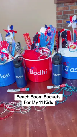 A post by @doughertydozen on TikTok caption: Who’s ready for the beach?! #BeachVacation #BoomBucket #BoomBuckets #4thOfJuly #RedWhiteAndBlue #TravelPrep 