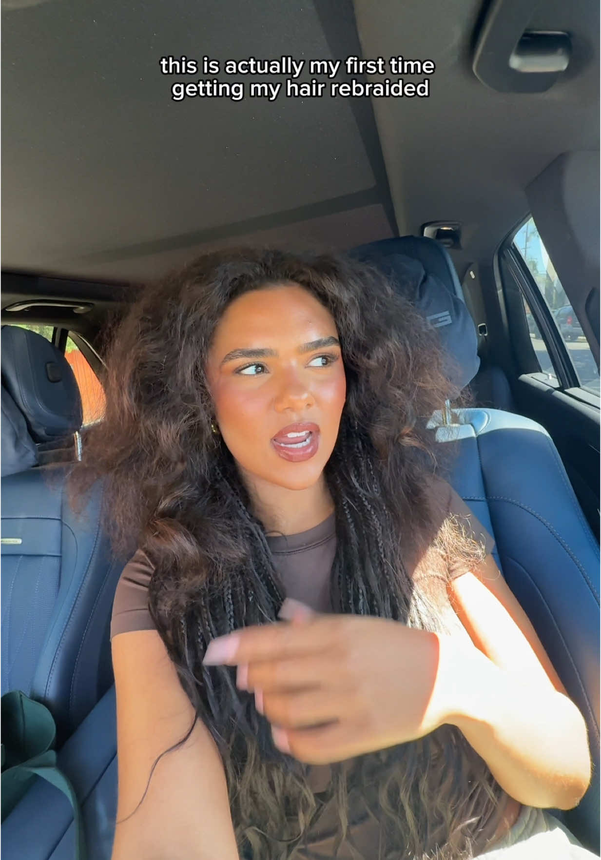A post by @makenzieandmalia on TikTok caption: Getting my braids touched up!   
