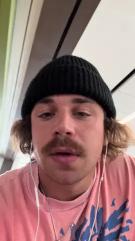A post by @dilkenstein on TikTok caption: At the airport now, flying out to Denver. super stoked. Gonna take you guys on the road with the band. Stay tuned 🍊 #NewMusic 