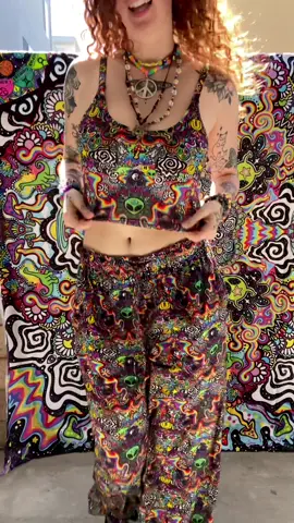 A post by @trippydraws on TikTok caption: I COLLABED WITH @iHeartRaves  This collab has been in the making for a while, and I’m sooo happy it’s finally here! ❤️🪐✨🌀 You can now buy my collection only on iHeartRaves.com❤️ This print means everything to me! it’s all of my favorite things I love to draw in one design. It is PLUR. I love you!!!! Go to iheartraves.com to get my limited edition DROP! ❤️