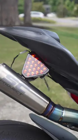 A post by @adobomoto on TikTok caption: How to install a brake light to any sport bike the easy way!