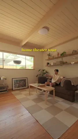 A post by @im_ericwang on TikTok caption: Converted my empty guest bedroom into a cozy home theater with some amazing scandinavian design pieces from @Teak New York! #teakpartner #teddysofa #furniture #design #hometheater #interiordesign #homedecor #bedroom 