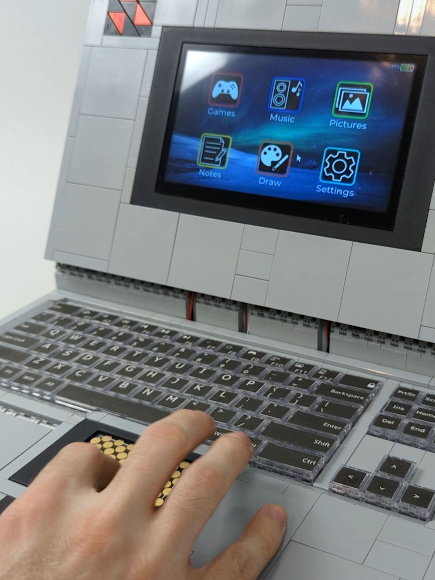 A post by @beyondthebrick on TikTok caption: Building a Working LEGO Laptop! Created by Brick Machines #lego #laptop