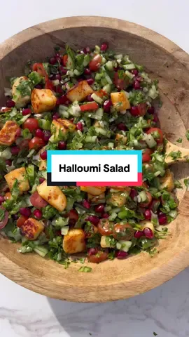 A post by @kauscooks on TikTok caption: Halloumi Salad 🥗 Reposting this one from last year as it was one of my most popular salads of 2022, still get messages from you guys of your recreation it and how much you love it, I love to see it!!  ✱ Halloumi ⋆ 225g Halloumi cheese ⋆ 1 tsp red pepper flakes ⋆ 2 Tbsp honey ✱ Salad ⋆ 1 whole cucumber ⋆ 1 bunch parsley  ⋆ 250g baby plum tomatoes ⋆ 1 cup pomegranate seeds ⋆ 2 spring onions ✱ Dressing ⋆ 1/4 cup extra virgin olive oil ⋆ Juice of 1 small lemon ⋆ 2 Tbsp pomegranate molasses ⋆ 2 Tbsp tahini  ⋆ 1 tsp sesame seeds ⋆ 1 tsp sumac ⋆ 1/2 tsp salt, or to taste ⋆ 1/2 tsp black pepper Shown in the video is a cold salad made in advance: Allow the halloumi to cool and add into salad. If you like your halloumi warm with your salad, do not mix in to the salad instead serve ontop of the salad whilst still warm. Delicious either way. Enjoy! #halloumi #saladrecipe 
